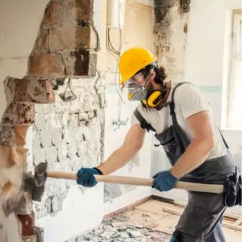 Worker using hammer, home renovation